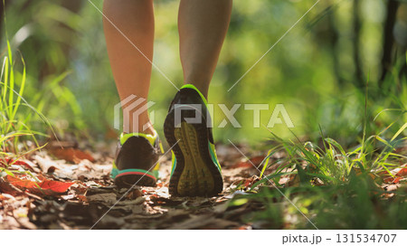 Woman runner running on forest trail Woman runner running on forest trail 131534707