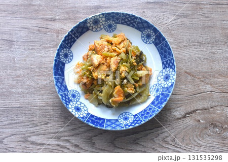 fried slice salty and sour Chinese pickled cabbage with egg in soy sauce on dish 131535298