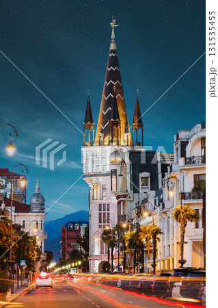 Batumi, Adjara, Georgia. Evening View On Former National Bank Building With Astronomical Clock On Europe Square Batumi, Adjara, Georgia. Evening View On Former National Bank Building With Astronomical Clock On Europe Square 131535455