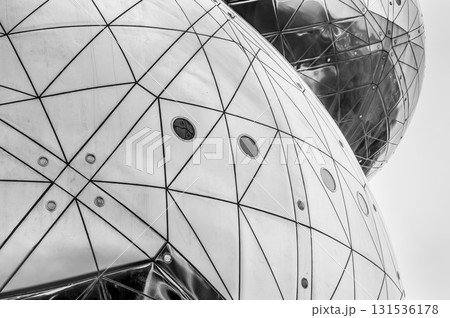 A geometric futuristic abstraction of two metal spheres in perspective. Horizontal black and white photo A geometric futuristic abstraction of two metal spheres in perspective. Horizontal black and white photo 131536178