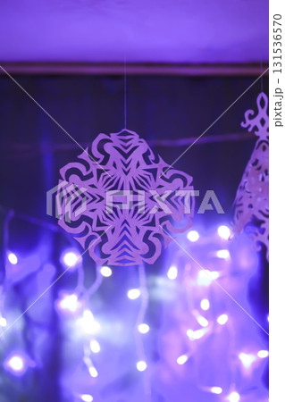 Cozy winter home interior with glowing Christmas window decorations. 131536570