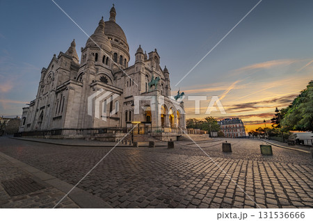 Montmartre sunset view of Sacre Coeur Basilica in Paris with vibrant skies 131536666