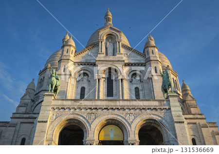 Montmartre sunset view of Sacre Coeur Basilica in Paris with vibrant skies Montmartre sunset view of Sacre Coeur Basilica in Paris with vibrant skies 131536669