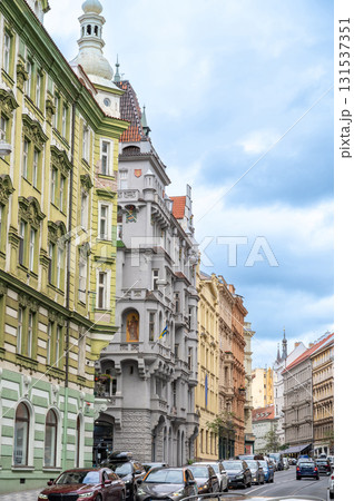 Prague, Czech Republic, August 7, 2023. Street view of the riverside promenade, with beautiful period houses with colorful facades overlooking the Vltava River. Vertical format. 131537351