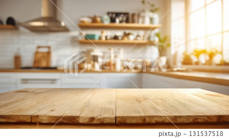 Wooden table in focus, with bright kitchen and warm golden sunlight bokeh backdrop. Wooden table in focus, with bright kitchen and warm golden sunlight bokeh backdrop. 131537518