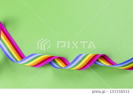 Rainbow ribbon on green background representing LGBT pride 131538531