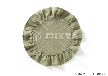 Cooking green round kitchen napkin or towel with ruffle isolated on white background. Top view. 131538574