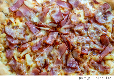 Close up of bacon and cheese pizza Close up of bacon and cheese pizza 131539132
