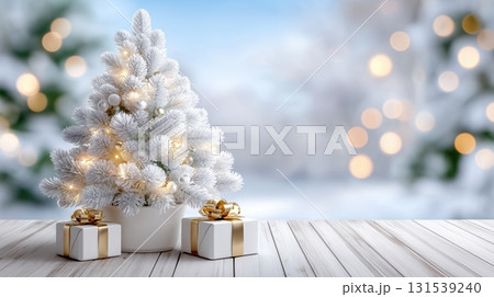 White Christmas tree with golden lights and gifts on a wooden table, winter background 131539240