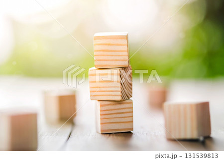 Ladder career path for business growth success process concept. Wooden blocks are stacked in steps that continue to rise. 131539813