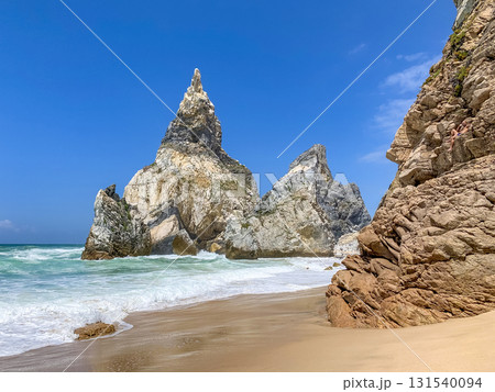 Ursa beach features dramatic rock formations and golden sand. Ursa beach features dramatic rock formations and golden sand. 131540094