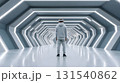 Immersive virtual reality experience in futuristic corridor with person wearing headset. sleek design and bright lights create engaging atmosphere for exploration 131540862