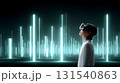 person wearing virtual reality goggles stands in immersive 3D environment filled with glowing vertical lights, exploring futuristic digital world. scene evokes sense of wonder and curiosity 131540863