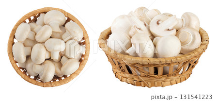Fresh mushroom champignon in a wicker basket isolated on white background. Top view. Flat lay 131541223