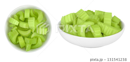 fresh celery in ceramic bowl isolated on white background. Top view. Flat lay 131541238