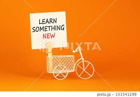Learn something new symbol. Concept words Learn something new on beautiful white paper on clothespin. Beautiful orange background. Business motivational learn something new concept. Copy space. Learn something new symbol. Concept words Learn something new on beautiful white paper on clothespin. Beautiful orange background. Business motivational learn something new concept. Copy space. 131541299