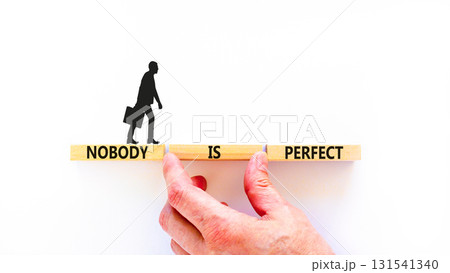 Nobody is perfect symbol. Concept words Nobody is perfect on beautiful wooden block. Beautiful white background. Business motivational lifestyle and nobody is perfect concept. Copy space. 131541340