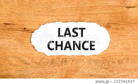 Last chance symbol. Concept word Last chance on beautiful white paper. Beautiful wooden paper background. Business last chance concept. Copy space. 131541437