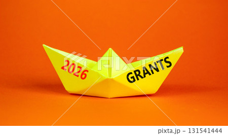 2026 Grants symbol. Concept words 2026 Grants on beautiful yellow paper boat. Beautiful orange paper background. Business and 2026 grants concept. Copy space. 131541444