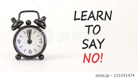 Learn to say no symbol. Concept words phrase Learn to say no on beautiful white paper. Black alarm clock. Beautiful white paper background. Business psychological Learn to say no concept. Copy space. Learn to say no symbol. Concept words phrase Learn to say no on beautiful white paper. Black alarm clock. Beautiful white paper background. Business psychological Learn to say no concept. Copy space. 131541474