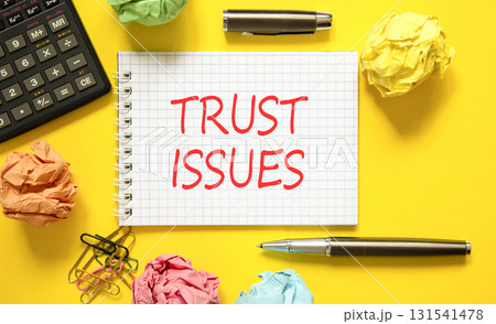 Trust issues symbol. Concept word Trust issues on beautiful white note. Black calculator. Black pen. Beautiful yellow paper background. Business trust issues concept. Copy space. Trust issues symbol. Concept word Trust issues on beautiful white note. Black calculator. Black pen. Beautiful yellow paper background. Business trust issues concept. Copy space. 131541478