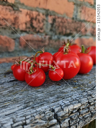 ripe red tomatoes on a wooden table in the garden ripe red tomatoes on a wooden table in the garden 131542053