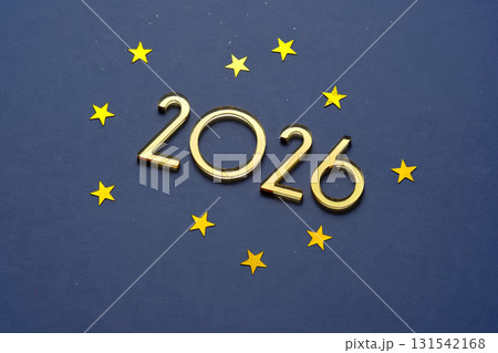 Abstract festive blue background with golden stars and the number is 2026. Abstract festive blue background with golden stars and the number is 2026. 131542168