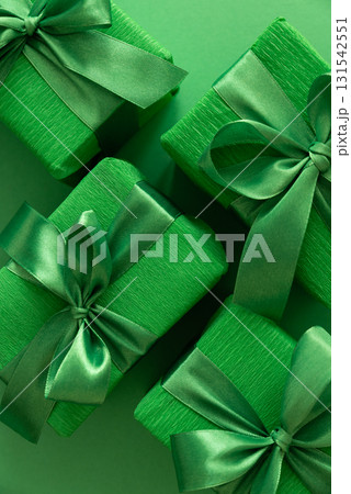 Green Gift Boxes on Solid Green Background with Copy Space 131542551