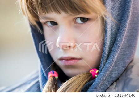 Portrait of happy child girl in warm clothes in autumn outdoors. Portrait of happy child girl in warm clothes in autumn outdoors. 131544146