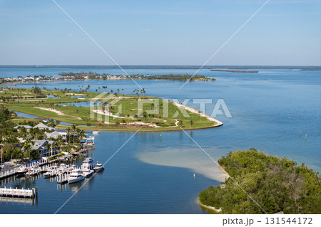 Oceanfront golf course in sunny Florida. Outdoor sport grounds with green grass lawns in Boca Grande, small town on Gasparilla Island 131544172