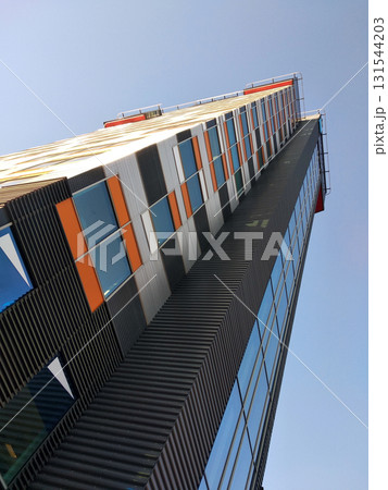Low angle view of high multistorey office building. Low angle view of high multistorey office building. 131544203