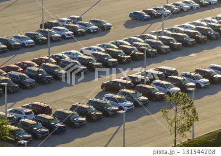 Large parking lot of local dealer with many brand new cars parked for sale. Development of american automotive industry and distribution of manufactured vehicles concept Large parking lot of local dealer with many brand new cars parked for sale. Development of american automotive industry and distribution of manufactured vehicles concept 131544208