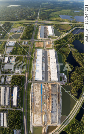 Industrial warehouse construction site. Assembling of metal and concrete frame of new logistics center in North Port, Florida 131544231