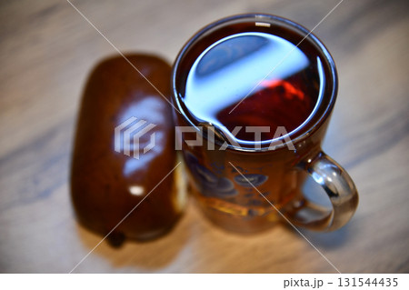 Delicious Cantonese breakfast or tea time treat featuring a pineapple bun paired perfectly with rich Hong Kong style milk tea, making it a popular choice among 131544435