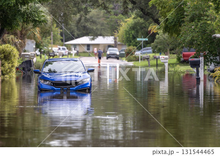 Flooded road with sunken cars in surrounded with water Florida residential area. Consequences of hurricane Debby natural disaster Flooded road with sunken cars in surrounded with water Florida residential area. Consequences of hurricane Debby natural disaster 131544465