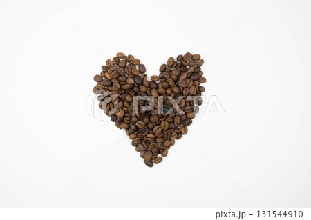 Cute heart of coffee beans on a white background Cute heart of coffee beans on a white background 131544910