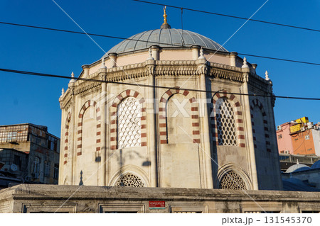 Sinan Pasa Medrese in Istanbul - Ottoman Architecture with Dome and Arched Windows Against Blue Sky Sinan Pasa Medrese in Istanbul - Ottoman Architecture with Dome and Arched Windows Against Blue Sky 131545370