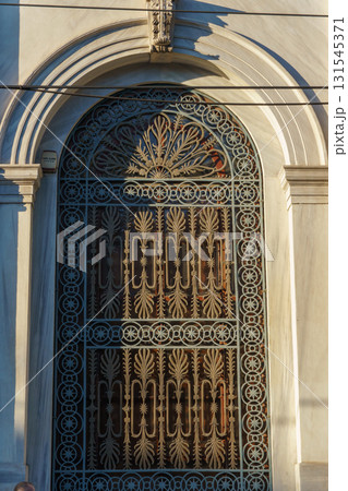 Ornate Wrought Iron Gate in Istanbul - Intricate Floral and Geometric Patterns on Arched Door at Golden Hour Ornate Wrought Iron Gate in Istanbul - Intricate Floral and Geometric Patterns on Arched Door at Golden Hour 131545371