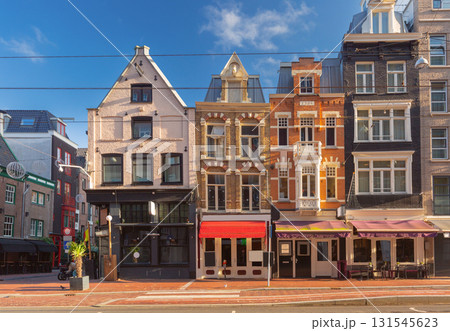 Street cafes and houses in Amsterdam Netherlands 131545623