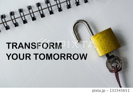 TRANSFORM YOUR TOMORROW, Inspirational notepad with padlock and key symbolizing change and improvement. 131545651