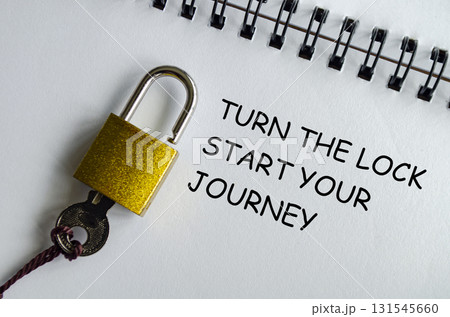 TURN THE LOCK, START YOUR JOURNEY, Motivational notepad with padlock and key symbolizing first steps. TURN THE LOCK, START YOUR JOURNEY, Motivational notepad with padlock and key symbolizing first steps. 131545660