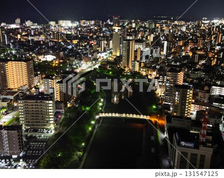 甲突川沿いから鹿児島市高麗町・荒田方面の夜景の空撮 甲突川沿いから鹿児島市高麗町・荒田方面の夜景の空撮 131547125
