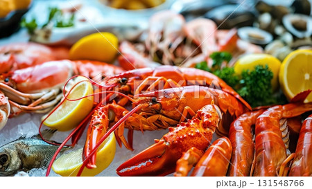 Gourmet seafood arrangement featuring golden lobster, succulent prawns, delicate fish on crisp ice, accented with zesty lemon and vibrant parsley 131548766