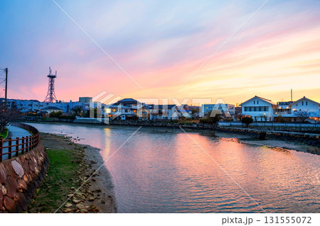 Japanese riverbank houses along Matsuura river at dusk, Saga, Japan Japanese riverbank houses along Matsuura river at dusk, Saga, Japan 131555072