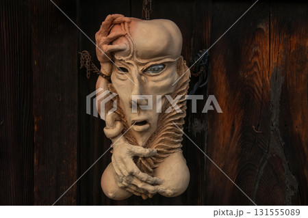 Human clay sculpture artwork hang on wall at Higashiyama, Kyoto 131555089