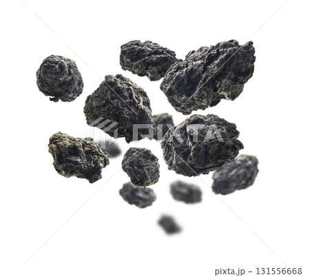 Green oolong tea levitates on white background Green oolong tea levitates on white background 131556668