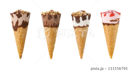 Four ice cream cones with chocolate, nuts, and strawberry toppings on white background 131556795