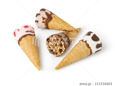 Ice cream cones lying on white background showing different flavors 131556803