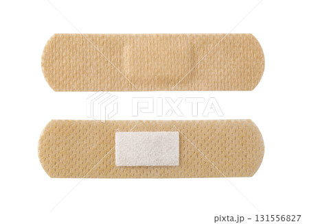 Two adhesive bandages on white background showing front and back 131556827