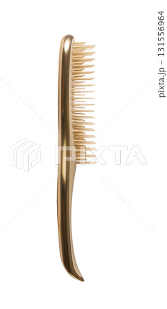 Golden hairbrush with plastic bristles on transparent background 131556964